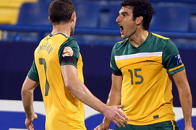 The then-Gençlerbirliği midfielder celebrates his goal with Brett Emerton.