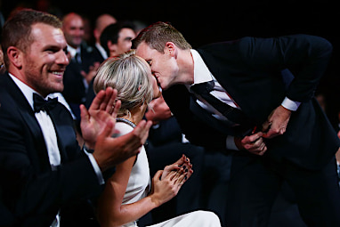 He sealed his first win with a kiss.