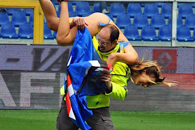 She can be seen laughing as she is carried off. (AAP)