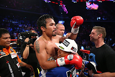 The Filipino icon celebrates the win.