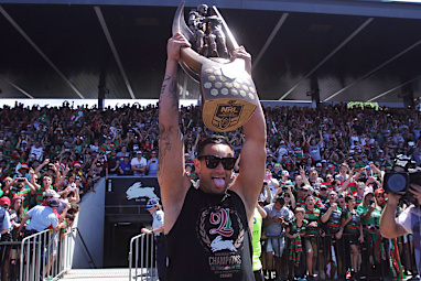 Sutton lifts the NRL trophy to the roar of Bunnies fans.