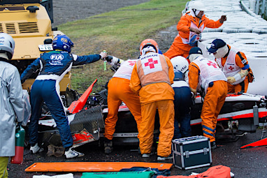 The Marussia driver collided with a tractor in a wet Japan Grand Prix. (AAP)