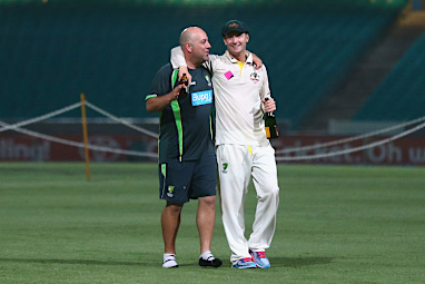 Captain Michael Clarke relaxed with coach Darren Lehmann.