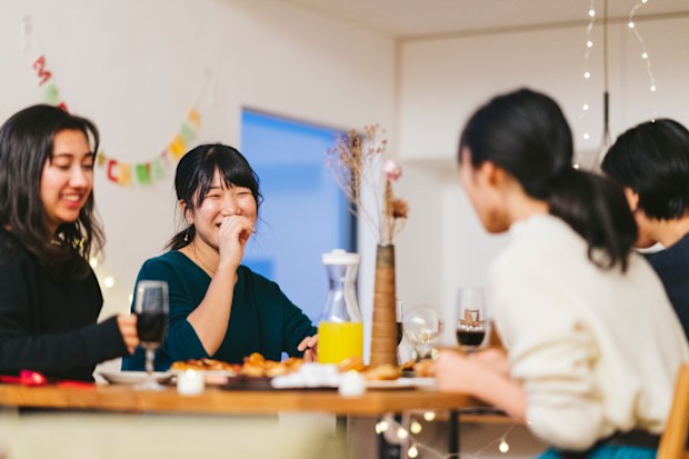 A group of young female friends at a dinner party