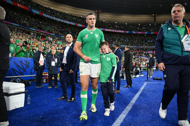 Johnny Sexton consoles his son after Ireland lost to New Zealand in the quarter-final.