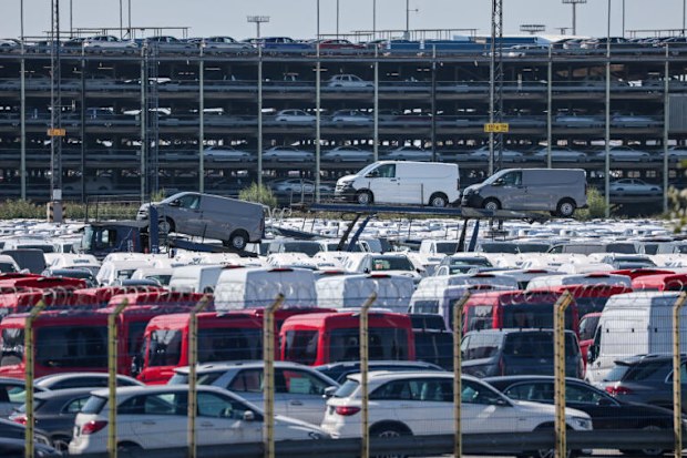 a card yard with hundreds of vans and suvs