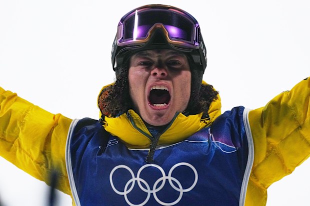 Australia's Valentino Guseli reacts after his landing his run during men's snowboard big air qualifications at the 2026 Winter Olympics, in Livigno, Italy, Thursday, Feb. 5, 2026. (AP Photo/Gregory Bull)