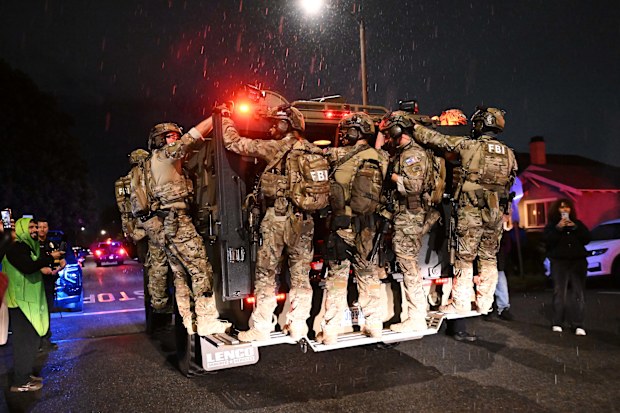 FBI officers at an address connected to Cole Tomas Allen, the shooting suspect at the White House Correspondents Dinner in Torrance, California.