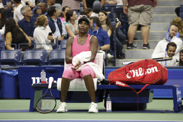 Venus Williams, of the United States, sits on the bench during a break in a match against Greet Minnen, of Belgium, at the first round of the U.S. Open tennis championships, Tuesday, Aug. 29, 2023, in New York. (AP Photo/Jason DeCrow)