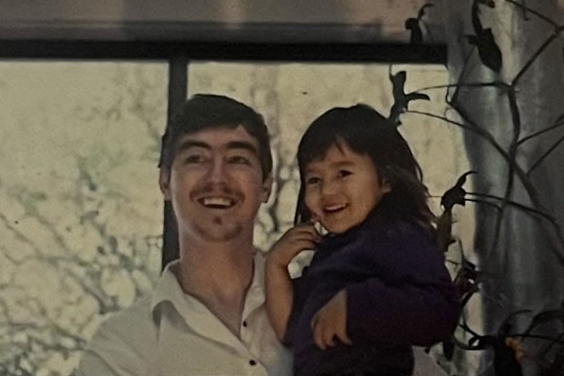 Emily Geelen with dad Paul at her family's ocularistry business as a child.