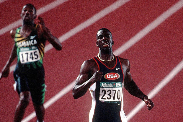 US sprinter Michael Johnson won gold in the 400m and set a new Olympic record at the Sydney 2000 Games.