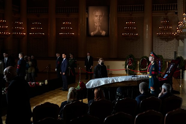 Honour guards stand by the coffin of former Soviet President Mikhail Gorbachev inside the Pillar Hall of the House of the Unions during a farewell ceremony in Moscow, Russia, Saturday, Sept. 3, 2022.  