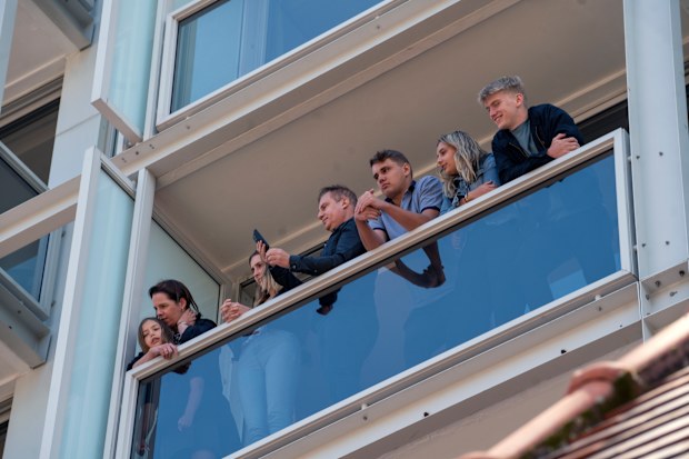 Hotel guests watch the hearse carrying the remains of Anglican Archbishop Emeritus Desmond Tutu leave St. George's Cathedral following his funeral service in Cape Town, South Africa, Saturday, Jan.1, 2022. 