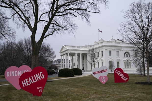 A Valentine's Day decoration, signed by first lady Jill Biden, sits on the North Lawn of the White House.