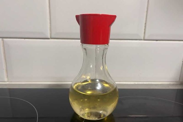 Olive oil hack using an old soy sauce bottle to make it drizzle out slower rather than pour
