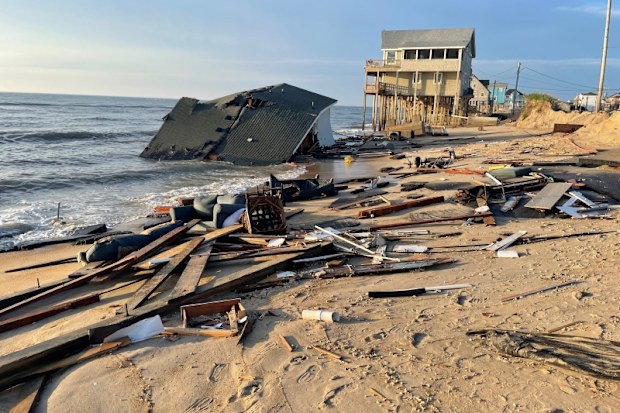 An empty house has collapsed and fallen into the ocean in the United States. 