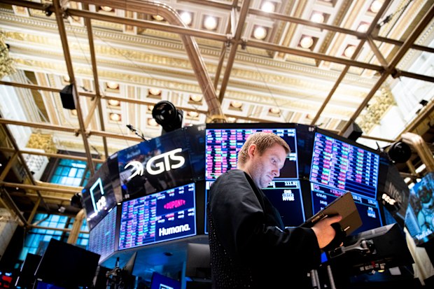 Traders work on the floor of the New York Stock Exchange 