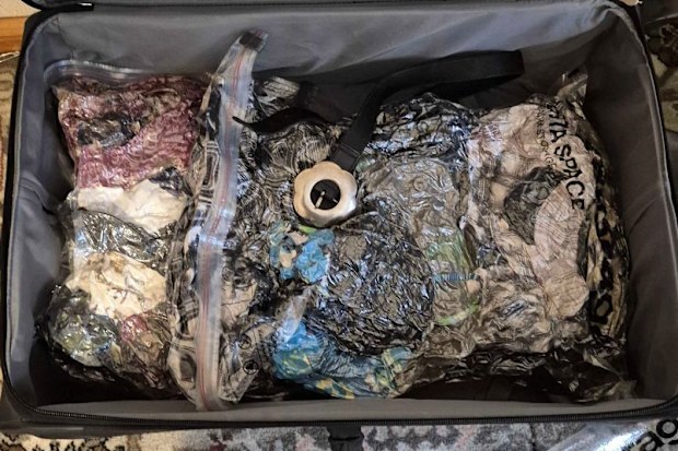 Packing up and moving to Australia suitcase vacuum seal clothing belongings