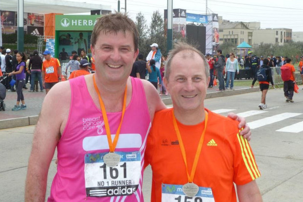 Tim Proudman (right) and a friend after completing another marathon. 