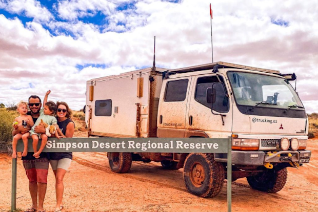The Zavros family at the Simpson Desert boundary line, thinking their next destination was in just hours.