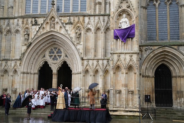 King Charles III and Camilla, the Queen Consort outside York Minster react as they unveil a statue of the late Queen Elizabeth II in York, England, Wednesday, November 9, 2022.