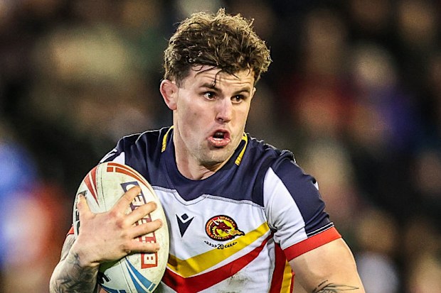 Toby Sexton of Catalans Dragons breaks with the ball.