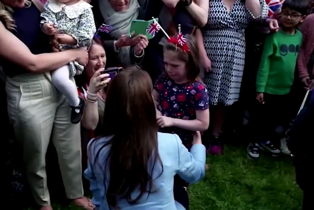 Kate embracing young fan