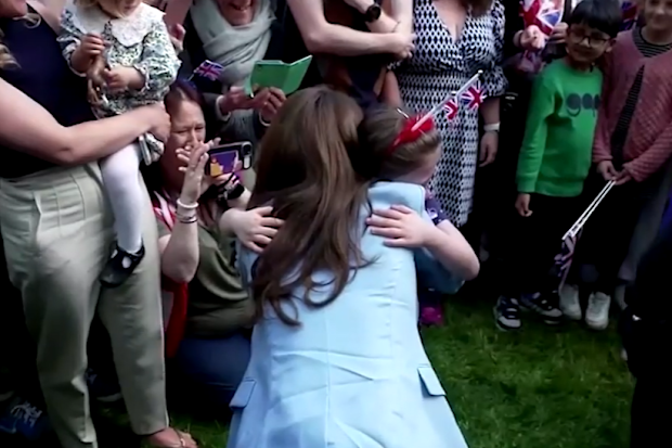 Kate embracing young fan