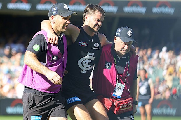 Brodie Kemp of the Blues taken from the ground with a leg injury.