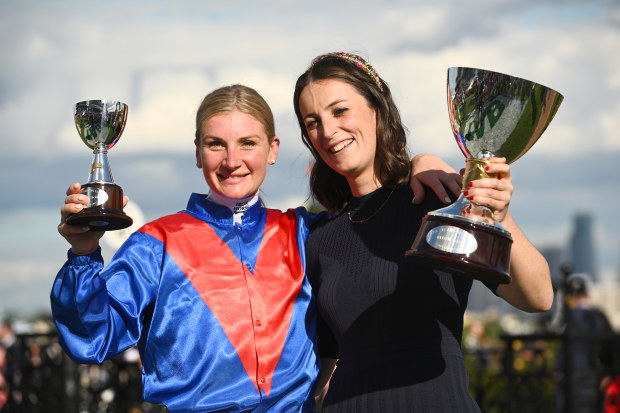 Jamie Kah and Trainer Annabel Neasham pose with the trophy after Zaaki won the 2022 Champions Stakes.