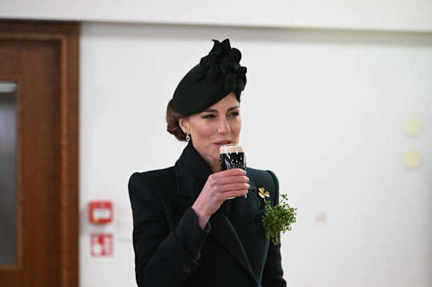 LONDON, ENGLAND - MARCH 17: Catherine, Princess of Wales in her role as Colonel, Irish Guards, takes a sip of Guinness during a visit to the 2025 Irish Guards' St. Patrick's Day Parade at Wellington Barracks on March 17, 2025 in London, England. Catherine, Princess of Wales attends the parade as Colonel of the Regiment. (Photo by  Eddie Mulholland - WPA Pool/Getty Images)
