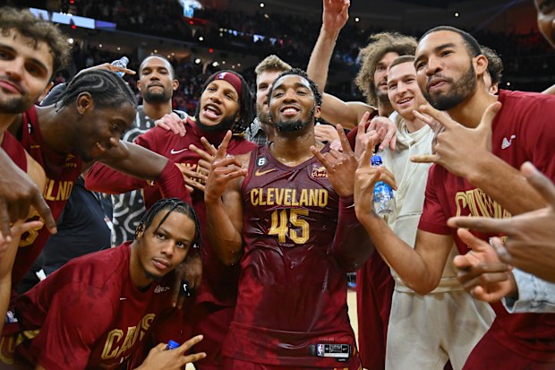 CLEVELAND, OHIO - JANUARY 02: Donovan Mitchell #45 of the Cleveland Cavaliers celebrates with his teammates after scoring a Cavaliers franchise record 71 points against the Chicago Bulls at Rocket Mortgage Fieldhouse on January 02, 2023 in Cleveland, Ohio. The Cavaliers defeated the Bulls 145-134. NOTE TO USER: User expressly acknowledges and agrees that, by downloading and or using this photograph, User is consenting to the terms and conditions of the Getty Images License Agreement. (Photo by J