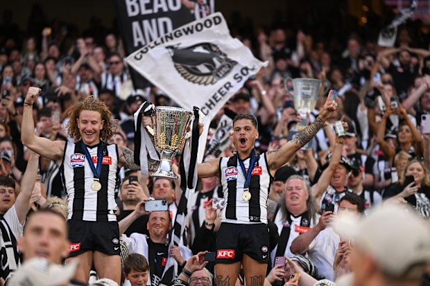 Collingwood's Beau McCreery and Bobby Hill celebrate the grand final triumph.