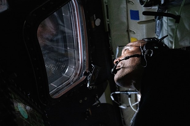 In this image provided by NASA,  Artemis II Pilot Victor Glover is photographed in the Orion spacecraft during the Artemis II lunar flyby on Monday, April 6, 2026. (NASA via AP)
