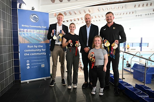 Prince William, Prince of Wales, British Olympians and Paralympians Adam Peaty (R), Tom Dean (L), Maisie Summers-Newton (front R) and Louise Fiddes (2nd L) 