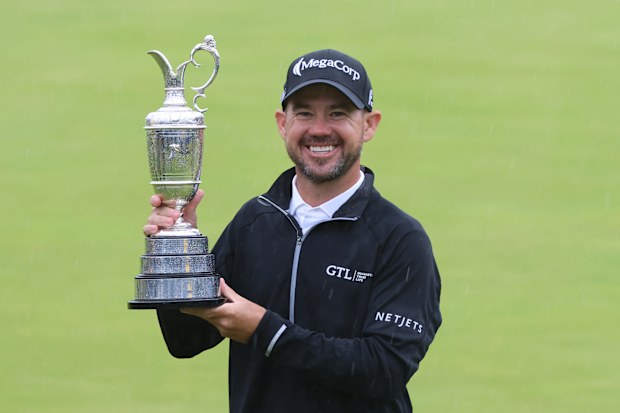 American Brian Harman holds the Claret jug after winning the 151st Open at Royal Liverpool Golf Club on July 23, 2023 in Hoylake, England. (Photo by MB Media/Getty Images)