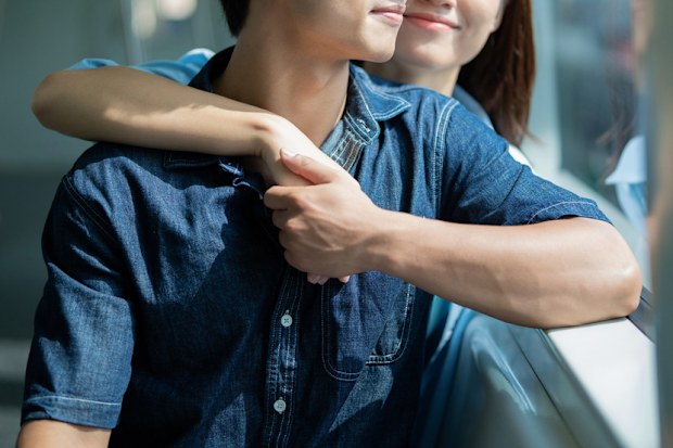 Photo of young Asian couple hang out together