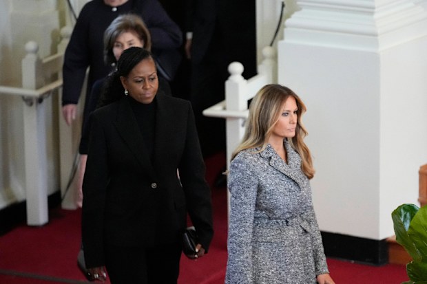 Former first ladies Melania Trump, Michelle Obama, Laura Bush and Hillary Clinton, arrive to attend a tribute service for former first lady Rosalynn Carter at Glenn Memorial Church, Tuesday, Nov. 28, 2023, in Atlanta. (AP Photo/Andrew Harnik)