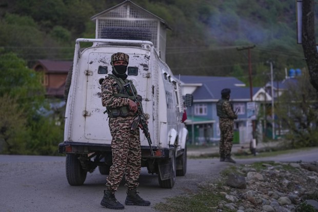Indian security officers patrol in armored vehicles near Pahalgam in south Kashmir after assailants indiscriminately opened fired at tourists in Pahalgam, Indian controlled Kashmir, Tuesday, April 22, 2025. (AP Photo/Dar Yasin)