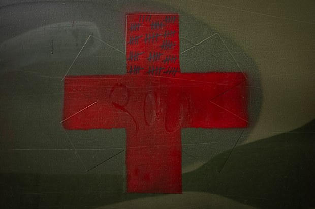 A scoreboard counts the number of injured people assisted and carried by a military ambulance personnel in the Donetsk region, eastern Ukraine, Tuesday, June 7, 2022.