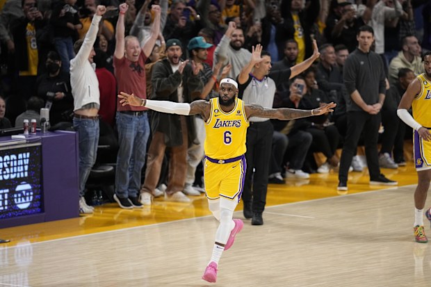 Los Angeles Lakers forward LeBron James celebrates after scoring to pass Kareem Abdul-Jabbar to become the NBA's all-time leading scorer during the second half of an NBA basketball game against the Oklahoma City Thunder Tuesday, Feb. 7, 2023, in Los Angeles. (AP Photo/Mark J. Terrill)