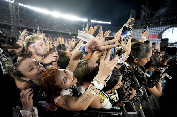 Fans attend the Taylor Swift: The Eras Tour concert, in Buenos Aires