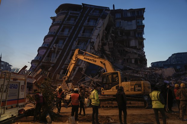 Rescuers search in the rubble of destroyed buildings in Antakya, southern Turkey, Thursday, Feb. 9, 2023. 