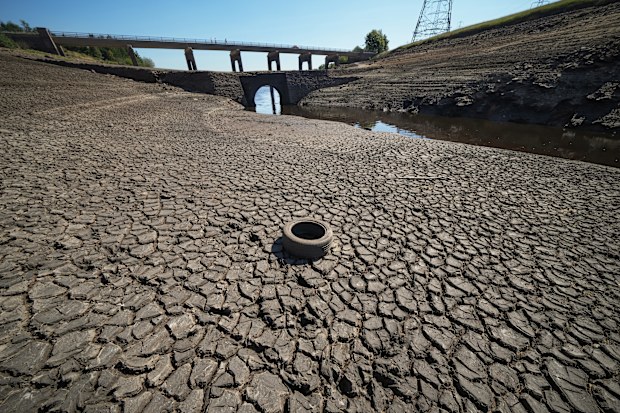 Low water levels at Baitings Reservoir reveal an ancient pack horse bridge as drought conditions continue in the heatwave on August 12, 2022 in Ripponden, United Kingdom. 