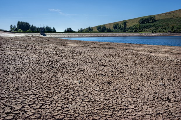 Dried and cracked mud is exposed as the water level at Beacons Reservoir recedes during the current heat wave, on August 12, 2022 in Merthyr Tydfil, Wales. 