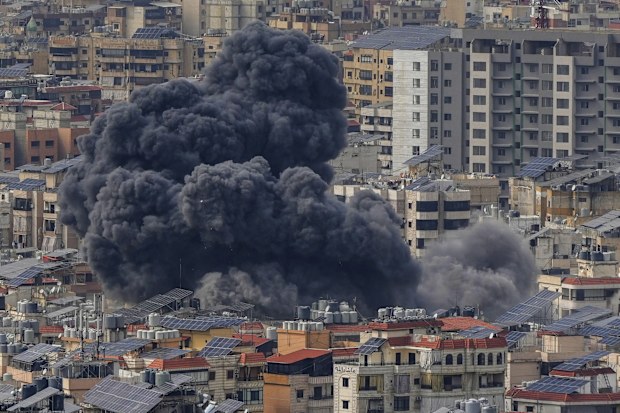 Smoke rises following an Israeli airstrike on Dahiyeh, in the southern suburb of Beirut, Lebanon, Friday, March 28, 2025