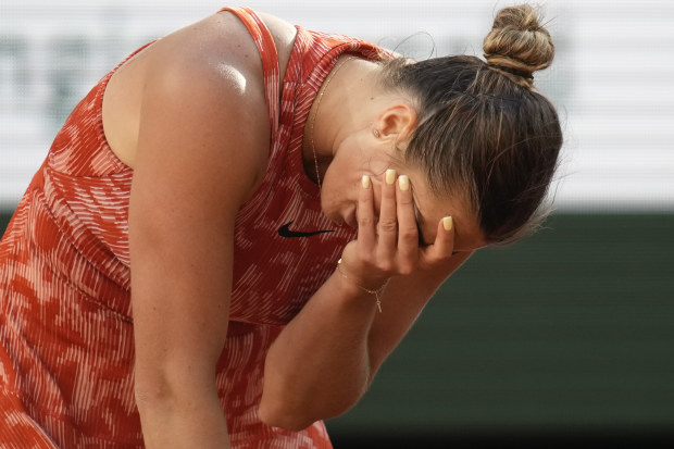 Aryna Sabalenka of Belarus reacts after missing a shot against Russia's Mirra Andreeva.