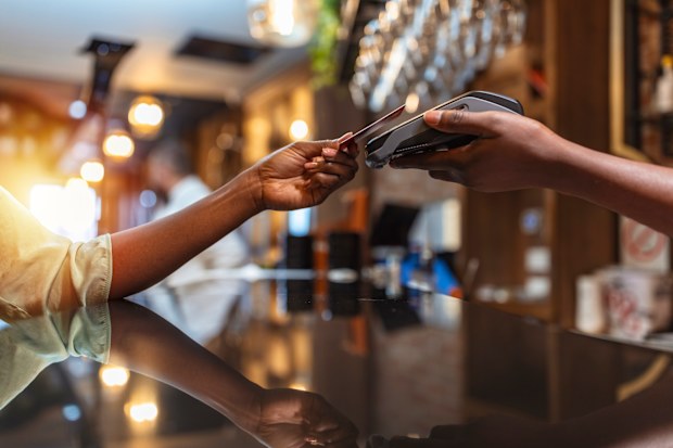 woman pays for dinner