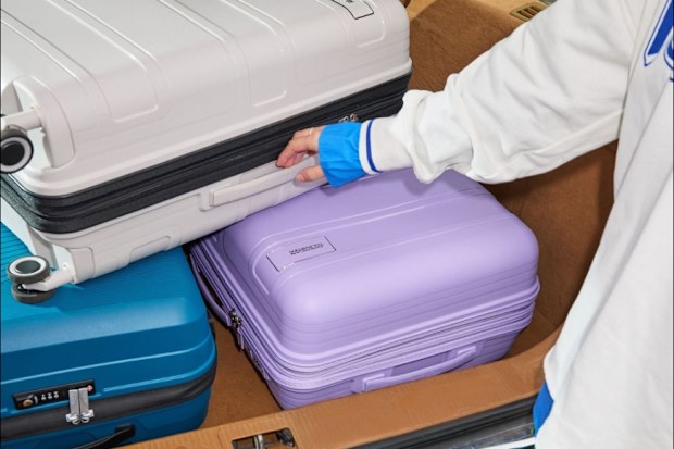 american tourister suitcases in a boot