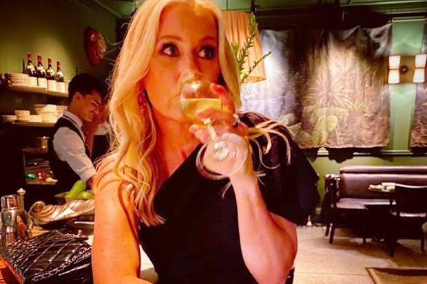 Sami Lukis has a drink in a bar.